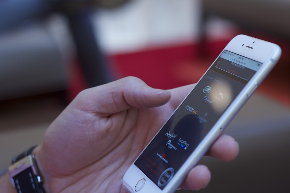 man using an iPhone